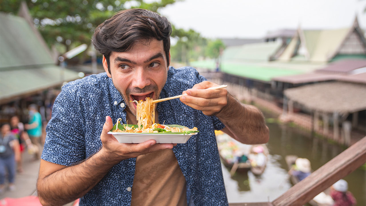 Guy eating noodle