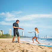 Father and daughter playing on the beach