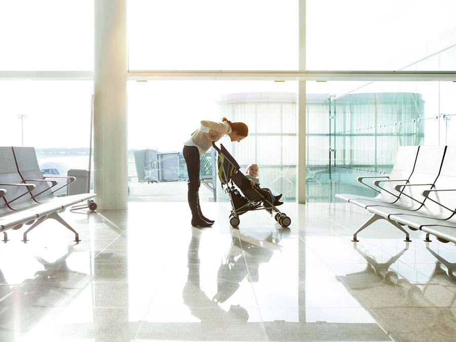 Mum and baby on a stroller in the airport