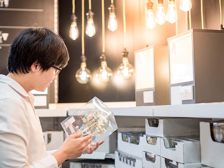 Man thinking twice about buying non essential items