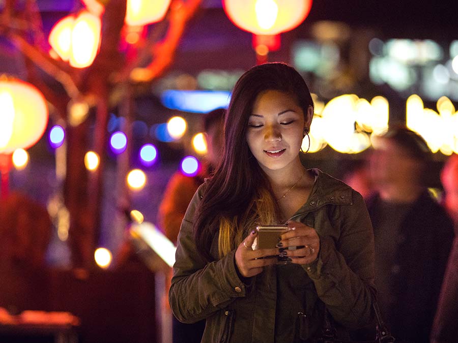 Girl on a mobile phone, using a local sim