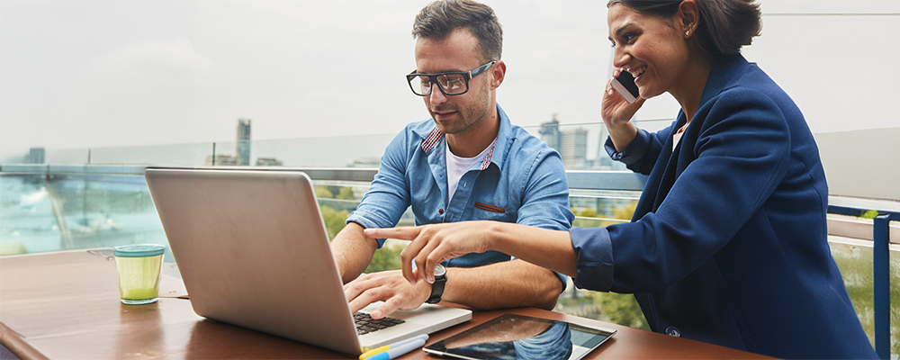 Man and woman looking at laptop