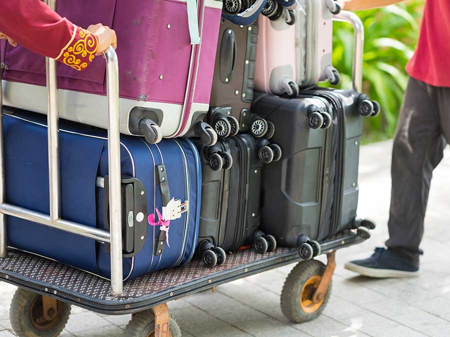 Hotel porter moving luggage