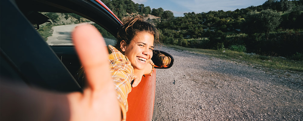 Person reaching out of car