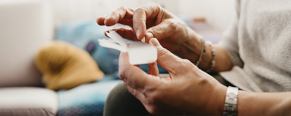 Someone holding a medication dispenser
