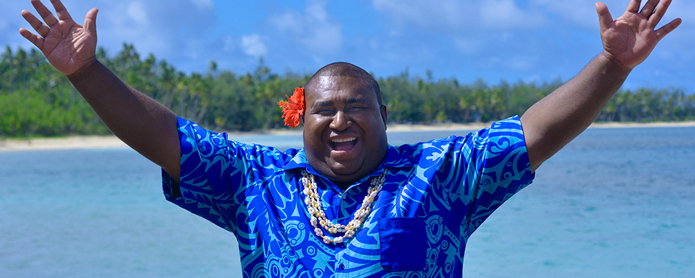 Man with his arm spread out in welcome