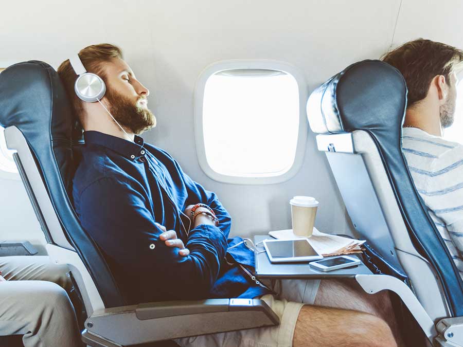 Man sleeping on a plane